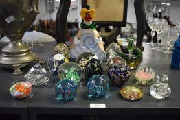 A vintage hand blown Venetian glass clown, h23cm, sold together with various paperweights, to