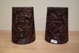 A pair of 20th century hand carved hard wood book ends, decorated having pierced chariot scenes in