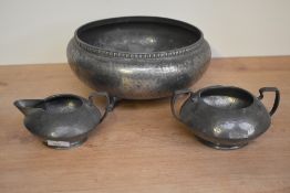A large footed Tudric pewter fruit bowl having hammered decoration, impressed makers mark to base,