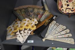 A group of vintage paper hand coloured Chinese style fans, to include a Japanese style bone fan, ( 7