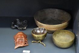 A 19th century brass and coconut Mazer bowl on tri-pod legs, h7cm, sold together with an early