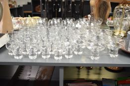 A large collection of various vintage liqueur glasses, decorated having etched floral pattern,