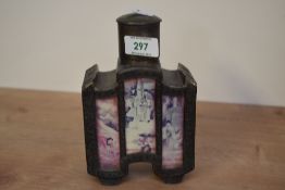 An early 20th century Chinese pewter tea cannister, having circular lift top and hand painted
