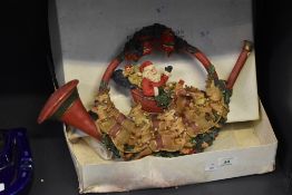 A mid / late 20th century Christmas Santa decorated round a painted brass bugle, h26cm, sold