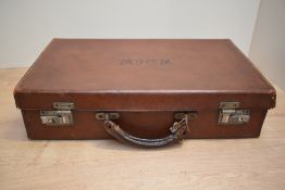 An early 20th century leather travel case, having working lock and key, impressed mark W.