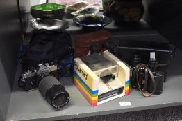 A retro Polaroid land camera 1000 in original box, sold together with a Fujica STX-1n with case