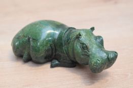 A vintage carved green hard stone hippopotamus, having polished body, possibly Malachite serpentine,