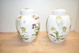 A pair of Poole pottery lidded ginger jars, decorated having Veronica anagallis-aquatica, Rumex