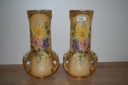 A stylish pair of early 20th century Austrian Turn-Teplitz-Bohemia porcelain three gilt handle vases