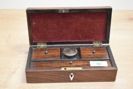 A 19th century rosewood writing box with pen, nib boxes, inkwell and comes with key 18.5x8.5cm
