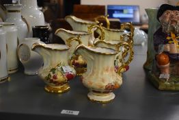 An attractive group of 6 Hammersdale Fine Bone China jugs, decorated having hand coloured pears,