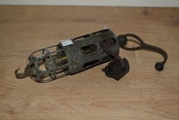 An early 20th century brass vehicle inspection lamp, having bird cage design, 26cm