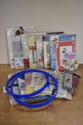 A bundle of vintage cross-stitch paraphernalia, including backing fabric, 9.5' diameter hoop, a
