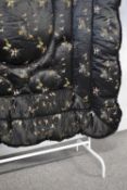 A circa 1930s Chinese Eiderdown blanket, in black silk with delicate embroidered birds and reeds