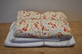 Three vintage bedspreads or quilts, including a cream yellow cotton example, having bevelled corners