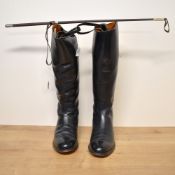 Two pairs of vintage leather riding boots and a riding whip. A pair of Regents Made in England black