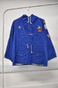 A rare and unique 1970s cotton pullover hooded smock jacket, patches from around Scotland and the