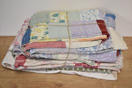 Three midcentury heavy patchwork quilts. One incorporates a diamond pattern around a central