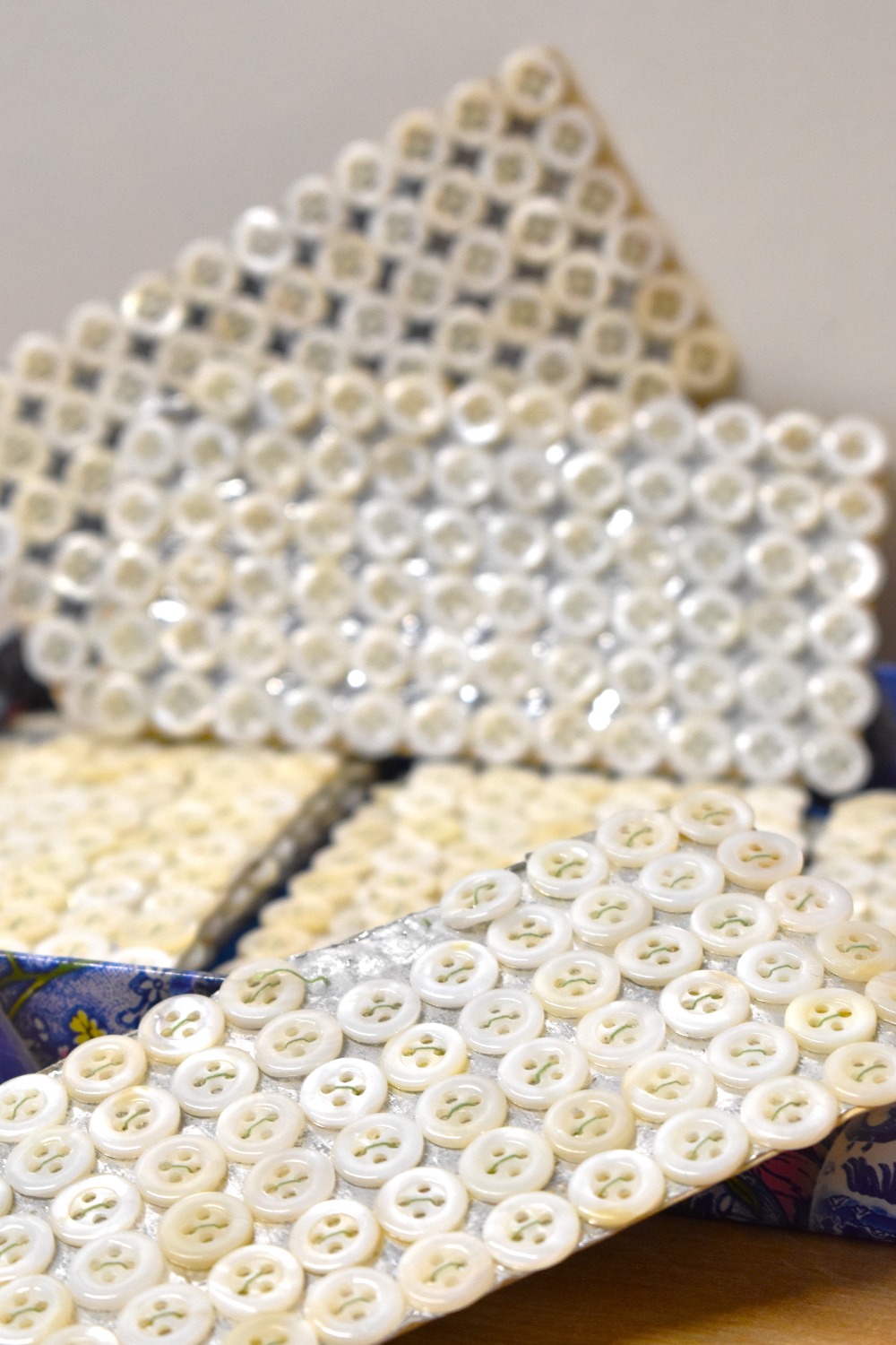 A quantity of vintage freshwater-shell shirt buttons, held in place on silver card with green - Image 7 of 15