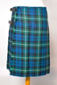 A 20th century L.Penrose kilt, in green, blue and black tartan with white accent stitching, pleated,