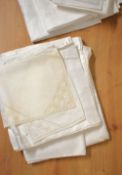 A quantity of vintage white cotton table cloths, place settings and furniture protectors,