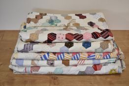 Three mid-century patchwork quilts, one having a diamond 'tumbling-block' design 97x80', two with