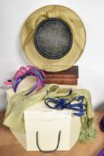A collection of modern wedding accessories, comprising a wide Viyella hat in navy and neutral