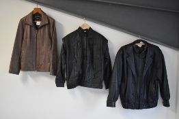 Four 1980s-1990s genuine leather unisex jackets. Two men's collarless bomber style jackets; A Made