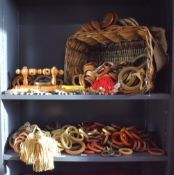 A quantity of antique wooden curtain hoops / rings, and carved woodwork fixings, various sizes