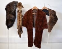 A collection of early- to mid- 20th century furs, comprising a rabbit waistcoat in cream, tan and