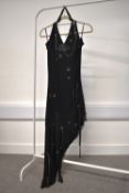 A rare and unique 1990-early 2000s assymetric halter dress in black jersey, featuring slinky chain
