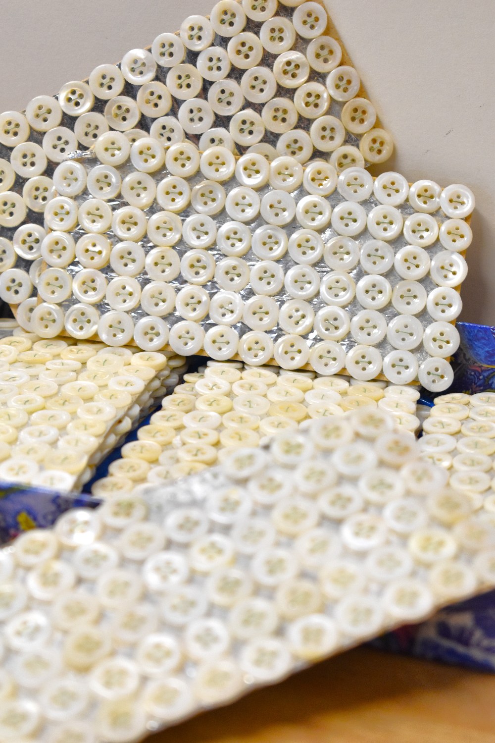 A quantity of vintage freshwater-shell shirt buttons, held in place on silver card with green - Image 6 of 15