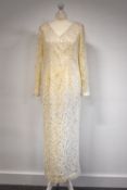 A collection of ladies occasional dressing items, comprising: A cream lace wedding or evening dress,