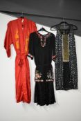 Five vintage garments, comprising: A red satin & silk kimono embroidered with orange dragon motif. A