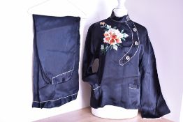A set of vintage pyjamas in black satin with Chinese inspired 'oriental' details, such as a Mandarin