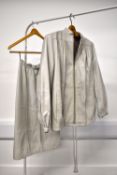 A 1980s Beged-Or skirt suit in pale grey genuine leather, having typical 1980s features such as