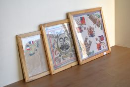 Three framed 20th century handkerchiefs. A 'Souvenir de France' white mesh / lace handkerchief