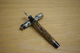A Parker Duofold Lady Deluxe button fill fountain pen in black and pearl with three gold bands to