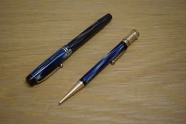 A Parker Duofold Special Steamlined Short button fill fountain pen and propelling pencil in blue and