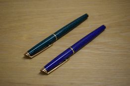 Two Waterman Hemisphere rollerball pens one in Green Marble the other Blue Marble