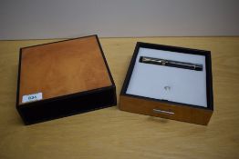 A boxed Parker Duofold Centennial converter fill fountain pen in chocolate pinstripe having