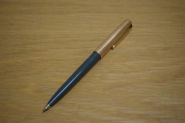 A Parker 51 ballpoint pen in grey with rolled gold cap.