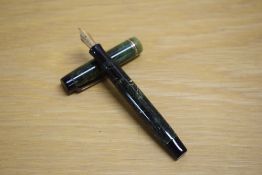 A Parker Duofold Lady button fill fountain pen in jade green with three gold bands to the cap having