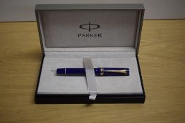 A boxed Parker Duofold International converter fill fountain pen in Lapis lazulii with gold trim