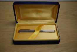 A Waterman Le Man 100 converter/ cartridge in sterling silver fluted design with gold trim having