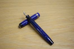 A Parker Duofold Lady button fill fountain pen in lapis lazulii with three gold bands to the ring