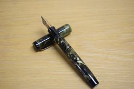 A Parker Duofold Deluxe Special button fill fountain pen in green and black marble with two narrow