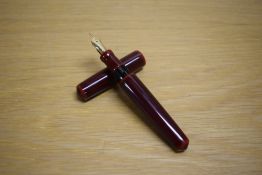 A Nakaya Writer Cigar Piccolo Cartridge fill fountain pen in Aka-Tamenuri lacquer finish having