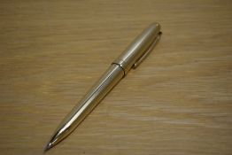 A Sheaffer Legacy propelling pencil in gold plate parallel line pattern.