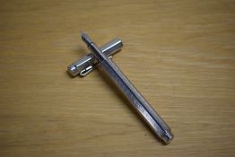 A Caran d'Ache Ecridor Chevron converter fill fountain pen with palladium plated barrel having